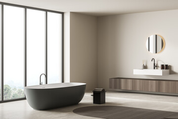 Fototapeta na wymiar Bright bathroom interior with bathtub, panoramic window, carpet, concrete floor