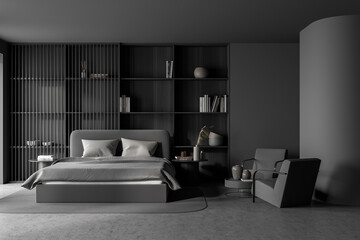 Dark bedroom interior with large bed, two armchairs