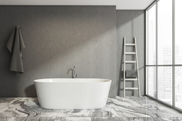 Dark bathroom interior with bathtub and empty concrete wall