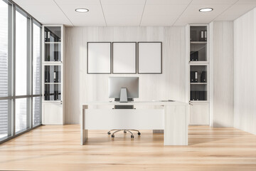 Bright office room interior with three empty posters