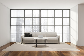 Living room interior with large comfortable sofa and panoramic window