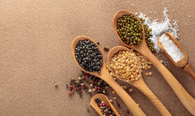 Various raw lentils with salt and pepper.