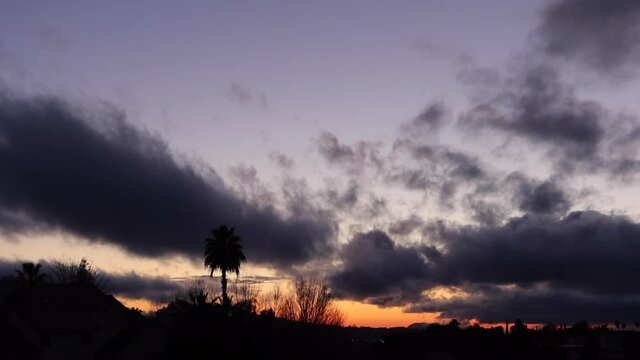 A Beautiful and Drastic Dramatic Sunset with Dynamic Orange Clouds