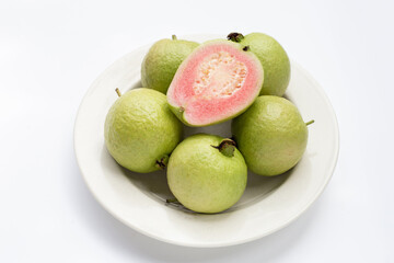 Fresh pink guava on white background.