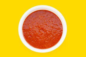 Suki Sauce in white bowl on yellow background.