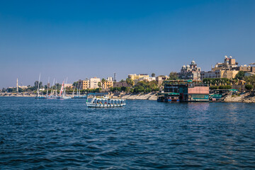 Fototapeta na wymiar Touristis boats on the Nile river in Luxor, Egypt