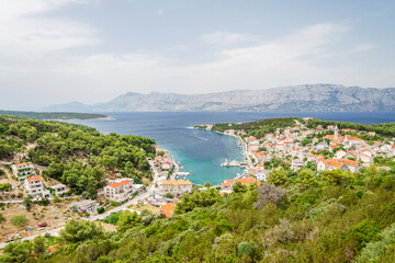 Naklejka na ściany i meble Spectacular view on Povlja town located on the north coast of Brac island in Croatia
