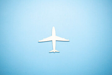 Naklejka na ściany i meble model of passenger plane on blue background
