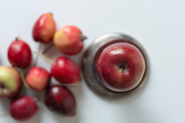 ripe crab apples on a light background