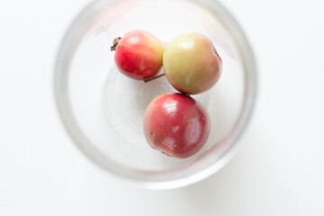 red crab apples in glass