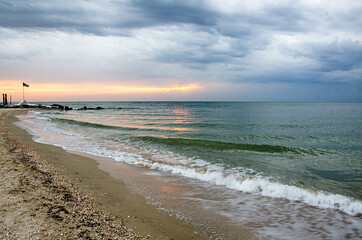 Cloudy morning by the sea. Sunrise.