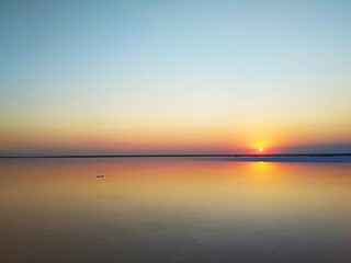  The area of salt extraction for healthy cosmetic.   Colorful sunset on pink lake in Ukraine.
