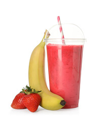 Delicious smoothie with straw in plastic cup and fresh fruits on white background