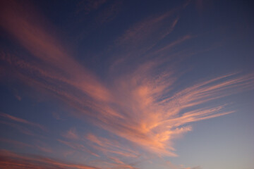 Fototapeta na wymiar A wide shot of a dramatic orange and blue sunset or sunrise sky