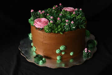 Elegant white wedding cake with flowers and succulents in boho style. Rustic Wedding Cake