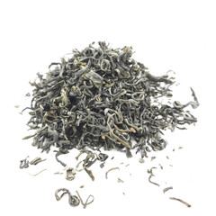 dried green tea leaves, isolated on white background