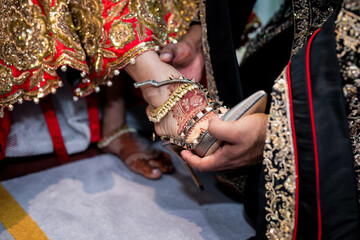 Fototapeta na wymiar Indian bride's wedding shoes close up