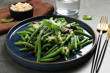 Tasty salad with green beans served on grey table