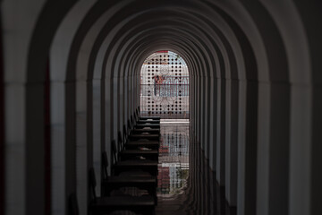 Perspective view of arch coridor within metal palace , Loha Prasat, Wat Ratchanadda, one of the most prestigious temple in Thailand.