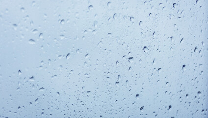 Condensation on the clear glass window. Water drops. Rain. Abstract background texture