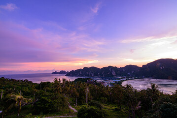 Twilight sunset on Phi Phi Don island view point. Beautiful landscape with tropical sea lagoon.
