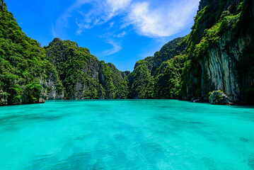 Travel vacation background Pileh bay at Phi Phi island. Blue sky