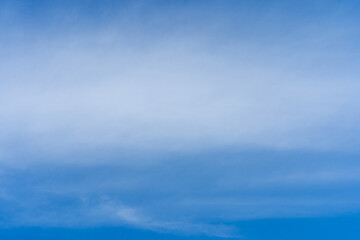 Flowing tiny cloud against blue sky.