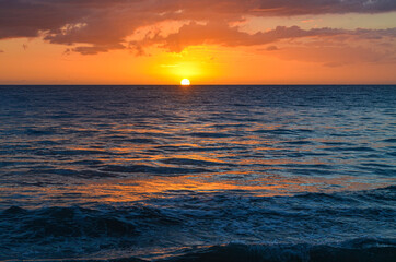 Perfect sunset on the western coast of Puerto Rico. Caribbean Sea. Rincon, PR. Copy space.
