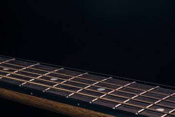 Fototapeta premium Close-up of an acoustic guitar fretboard copy space.