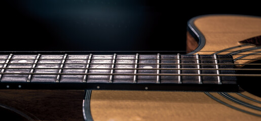 Close-up of a body part of an acoustic guitar.