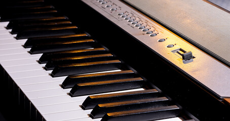 Close-up of keys of an electronic synthesizer.