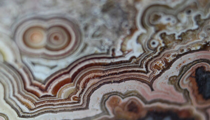 Close up of red and white swirled patterns of mexican laced agate 