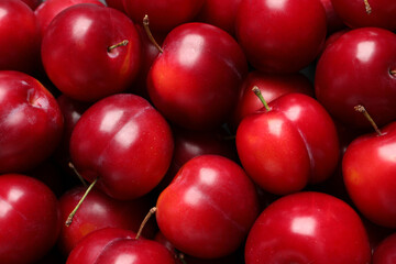Fresh ripe cherry plums as background, closeup