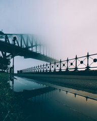Fog and mist obscures the Sydney Harbour Bridge