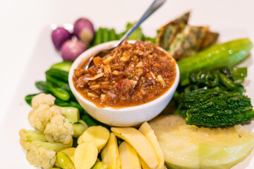 Thai spicy crab egg chili paste with fresh vegetable and herb.
