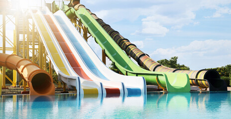 Beautiful view of water park with colorful slides and swimming pool on sunny day