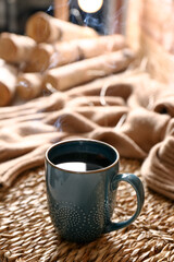 Wicker mat with freshly brewed tea in room. Cozy home atmosphere