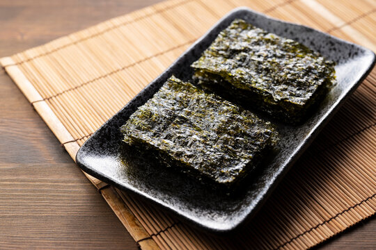 Korean seaweed on a wooden table. Asian food.