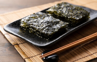 Korean seaweed on a wooden table. Asian food.