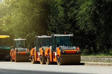 Modern rollers on city street. Road repair service