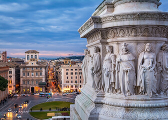 Fototapeta premium : A view of piazza di Venezia (square of Venice) and the detail of huge marble stone base of Victor Emmanuel II statue, as seen from the Altar of the Fatherland. Rome, Italy