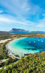 Fototapeta na wymiar View from above, stunning aerial view of Cala Brandinchi beach with its beautiful white sand, and crystal clear turquoise water. Tavolara island in the distance, Sardinia, Italy.