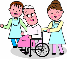 高齢男性が乗る車椅子に寄り添う介護の男女