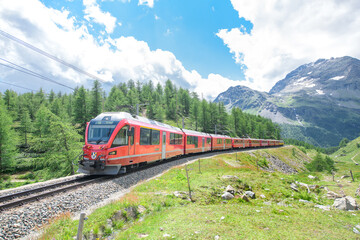 Fototapeta na wymiar Bernina tourist train on the Swiss alps