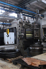 Bearing making machine. Large bearings. Heavy industry concept. Vertical photo.