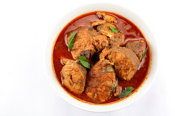 Kerala fish curry- homemade spicy king fish dish cooked with traditional recipes.