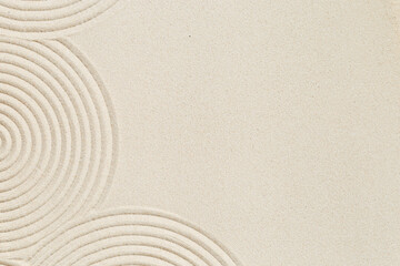 Lines drawing on sand, beautiful sandy texture. Spa background, concept for meditation and...