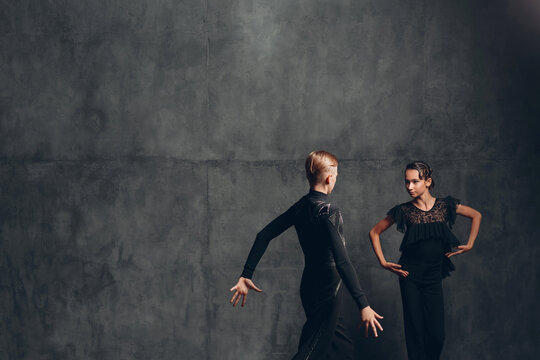 Young couple dancing in ballroom dance Paso doble.