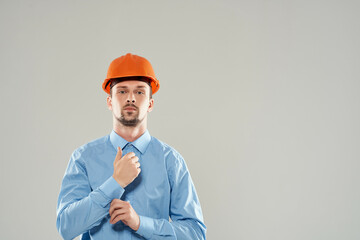 man in orange helmet blueprints builder Working profession