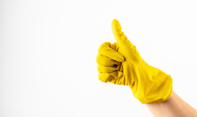 yellow glove for cleaning on arm show thumbs up. Yellow glove for cleaning  show thumbs up, isolated over white. Hand in yellow rubber glove, cleaning concept, gesture symbol ok, thumb up, 